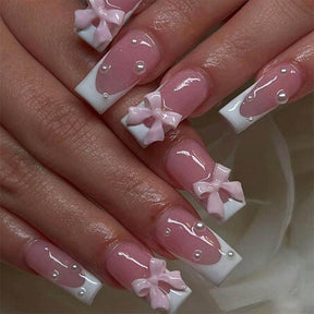 Classic White French Nails with Pearl and Pink Bow Accents