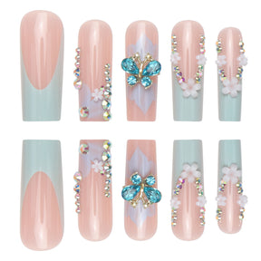 Long French Nail Extensions with Floral and Butterfly Design