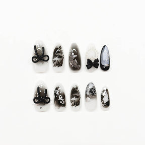 Black Almond Gradient Nails with 3D Bow, Pearls, Hearts, and Glitter