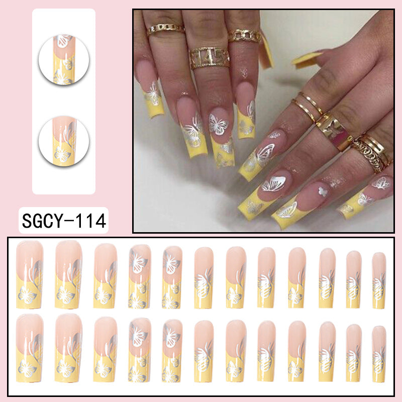 Yellow French Tip Nails with Silver Butterfly Design