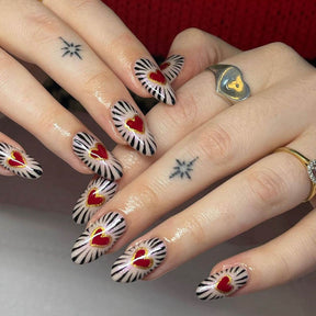 Valentine's Day Almond-Shaped Nails with Black Stripes and Red Hearts