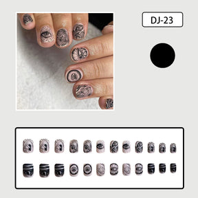 Skin Tone Matte Square Nails with Black Eyes Design