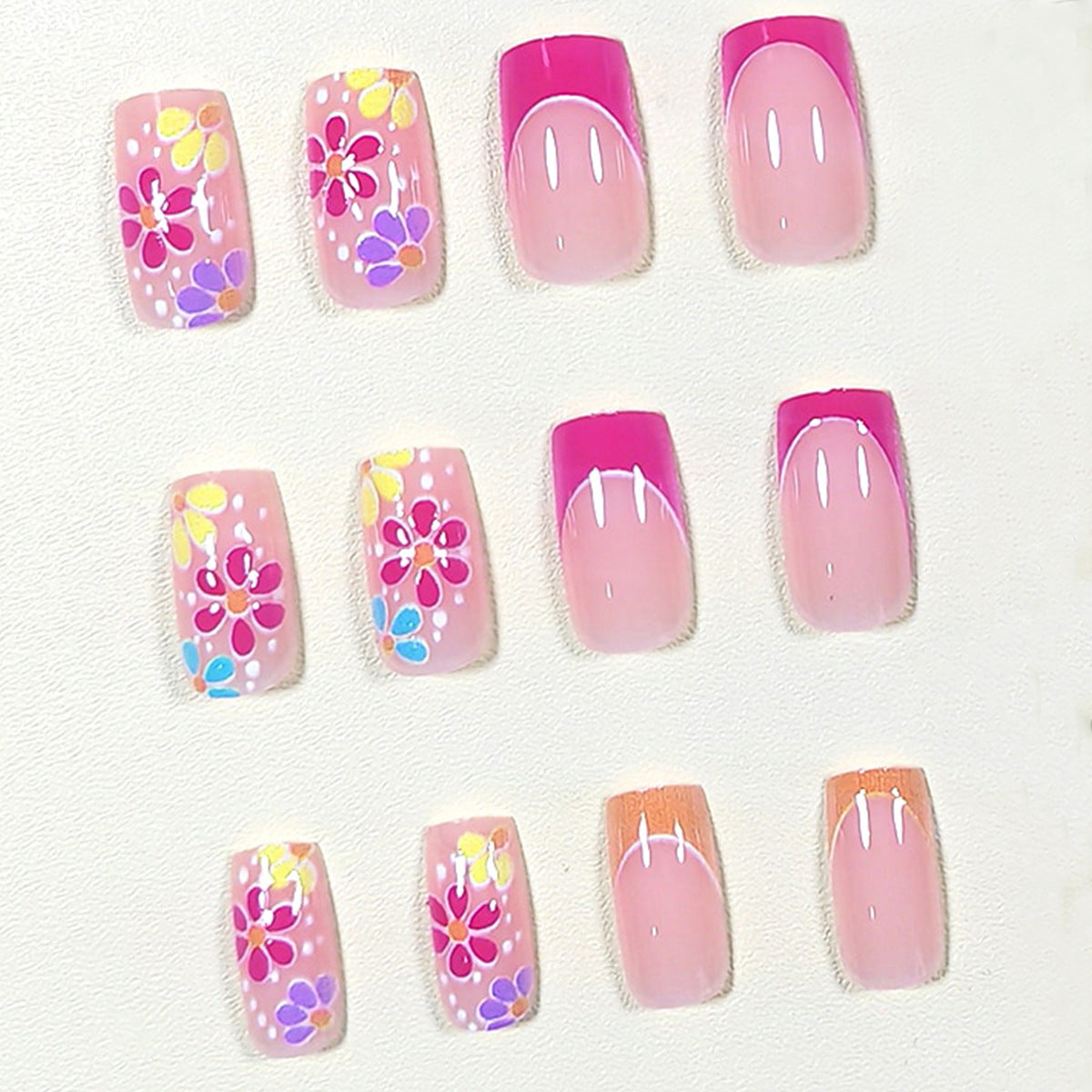 Cute Pink Orange French Nails with Floral Accents