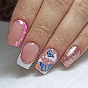 Blushing Pink Sparkle Nail Tips with Butterfly Design