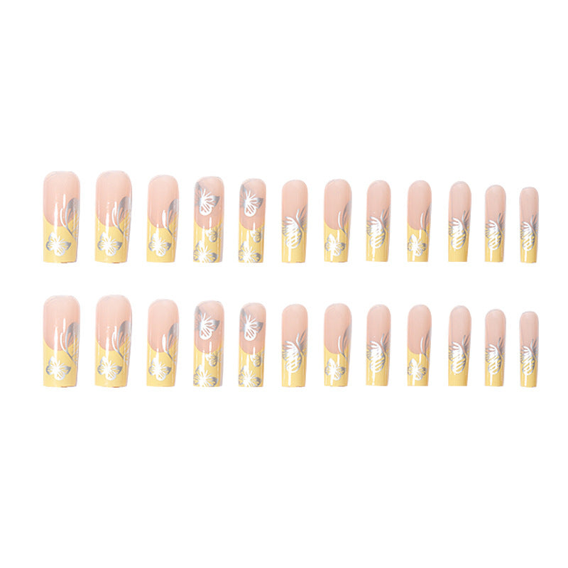 Yellow French Tip Nails with Silver Butterfly Design