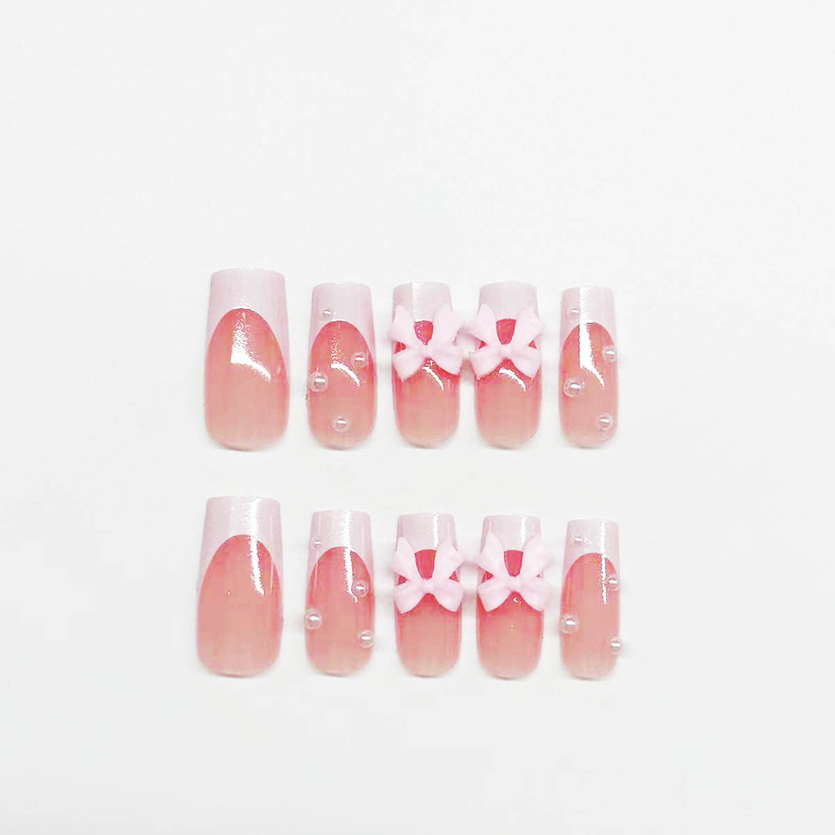 Classic White French Nails with Pearl and Pink Bow Accents