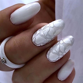 Mid-Length Oval Reverse French Nails with White Shell Fragments