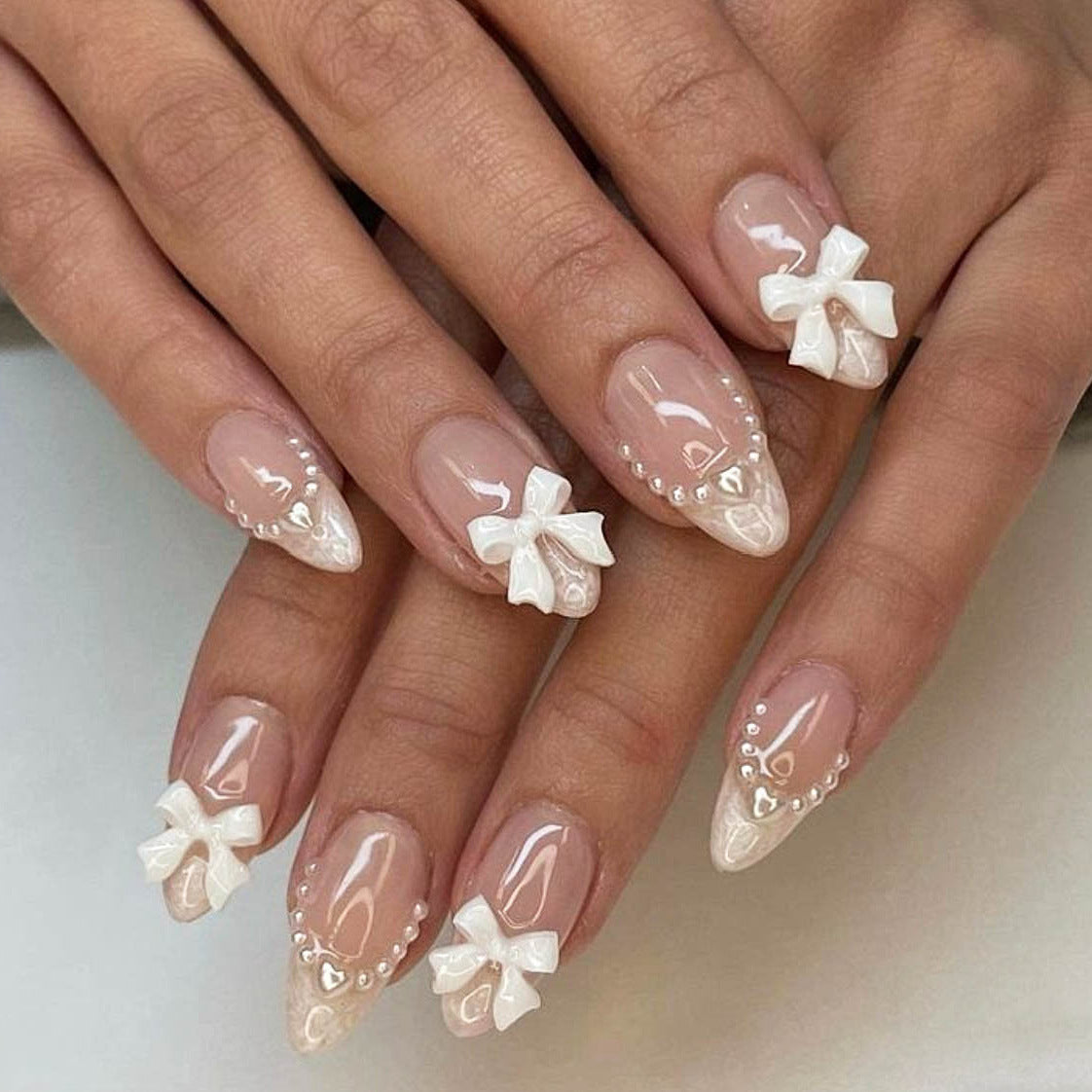 Sweet Short Almond White French Nails with Pearl and Bow Accents