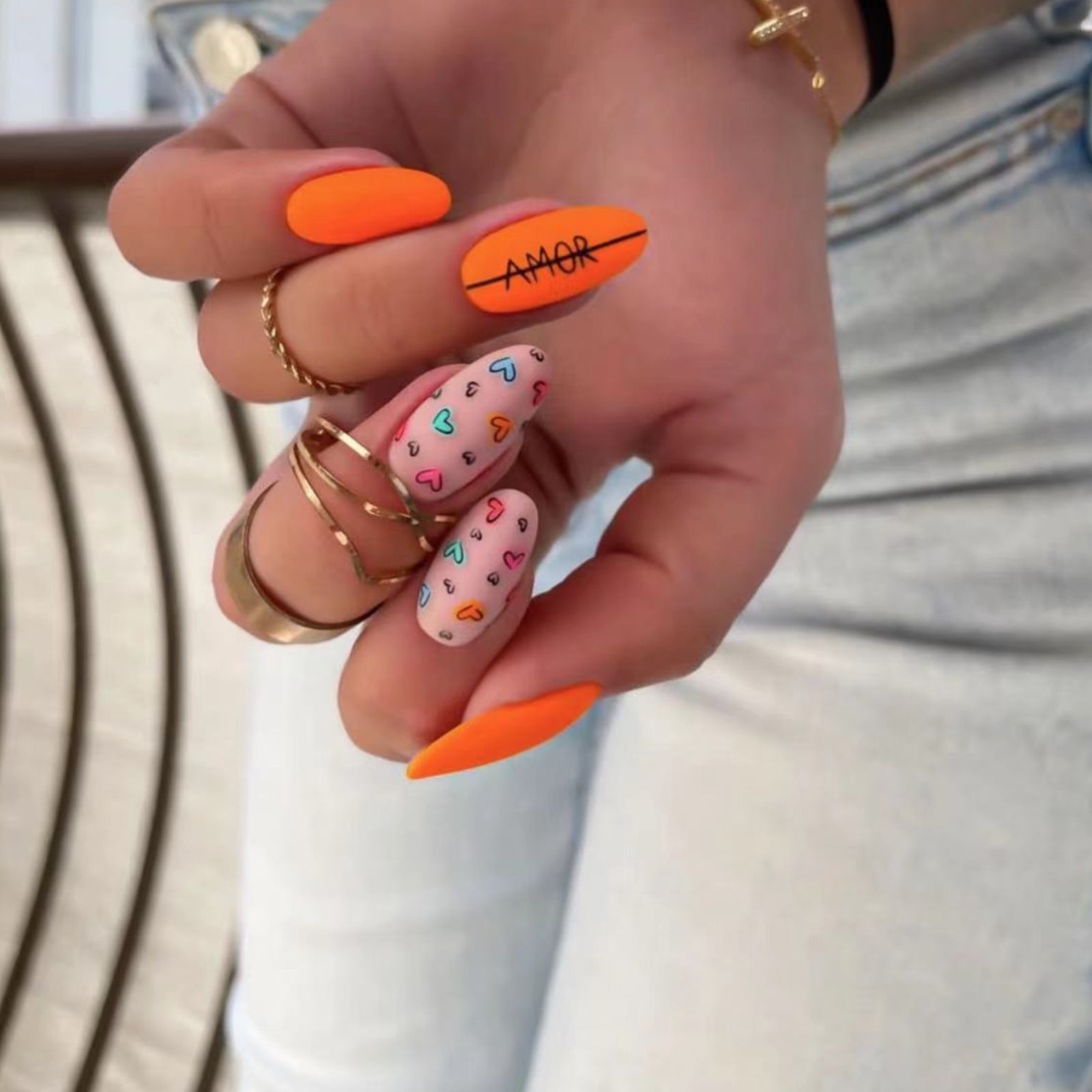 Valentine's Day Orange Almond Nails with Love Heart Designs