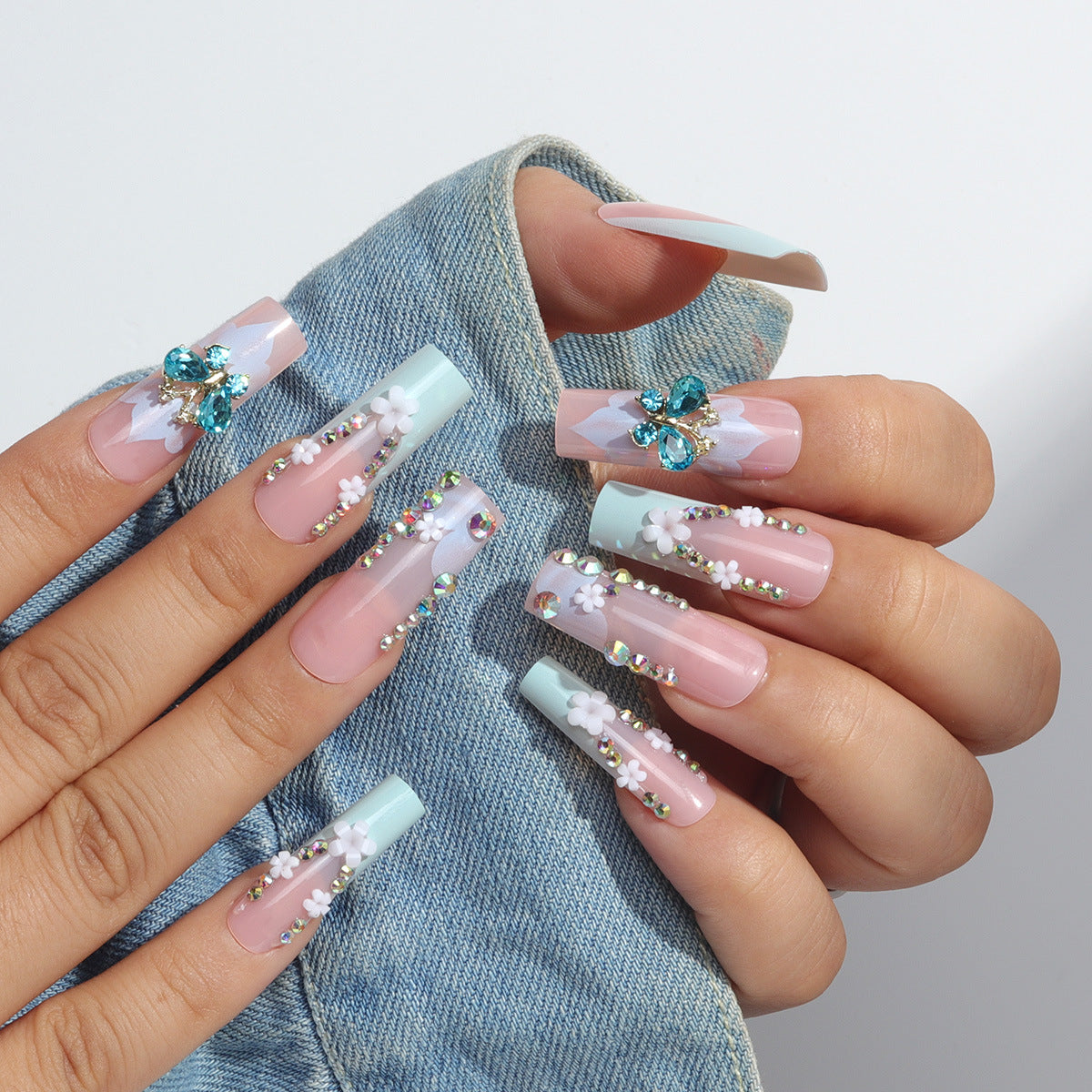 Long French Nail Extensions with Floral and Butterfly Design