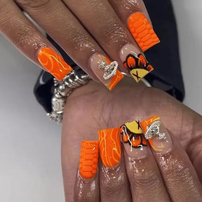 Shiny Orange Nails with 3D Printed Design