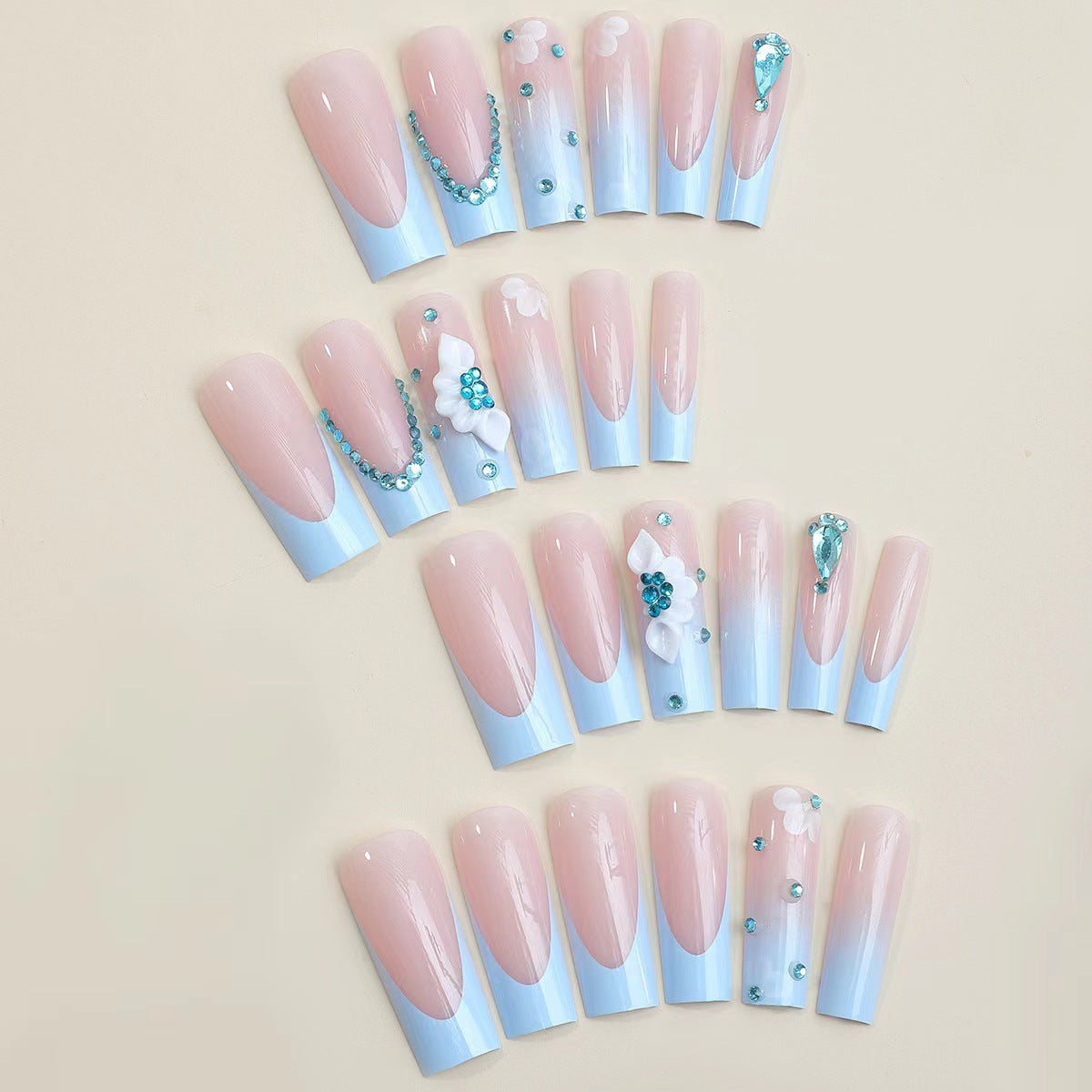 Elegant Light Blue French Nails with Crystal Chain and Flower Accents