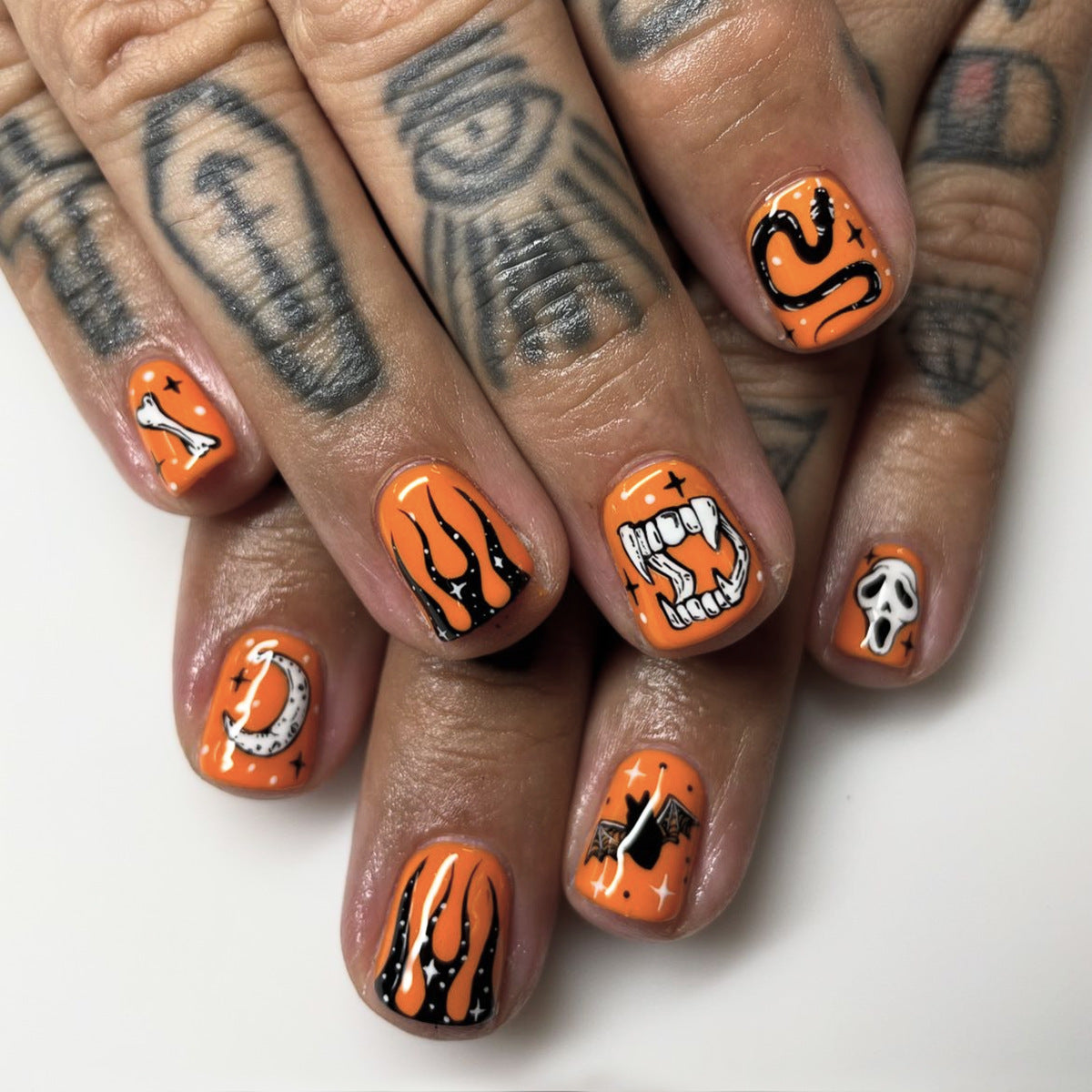 Black Flame Halloween Nails with Pumpkin, Bat, Skull, and Snake