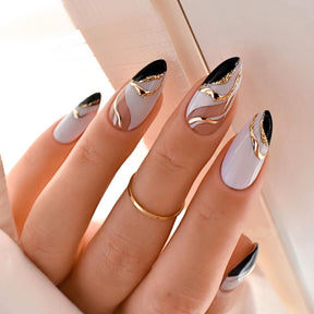 Almond-Shaped French Nail Tips with Gold Waves