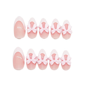 Short Almond White French Nails with Pink Bow Accents